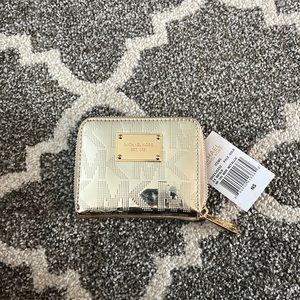 Michael Kors gold metallic MK Signature bifold wallet. NWT discontinued